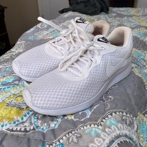 white nike athletic shoes